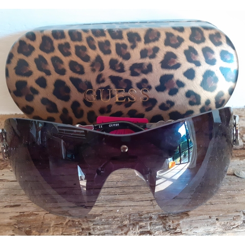 89 - Guess-A pair of ladies black frameless sunglasses with ornate silver tone arms and iconic 'G' encirc... 