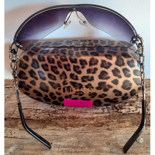 89 - Guess-A pair of ladies black frameless sunglasses with ornate silver tone arms and iconic 'G' encirc... 