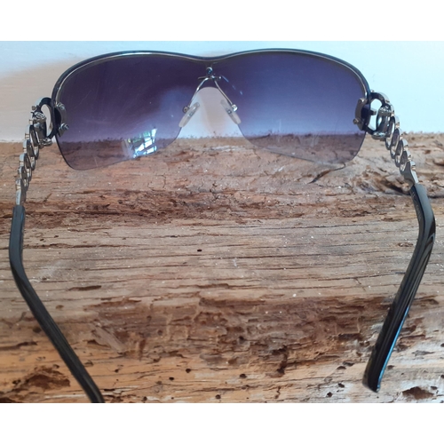 89 - Guess-A pair of ladies black frameless sunglasses with ornate silver tone arms and iconic 'G' encirc... 