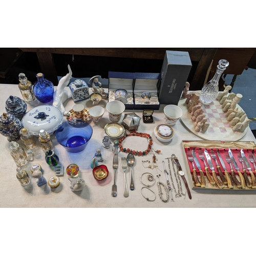 A mixed lot to include a boxed Waterford decanter, chess set, cutlery ...