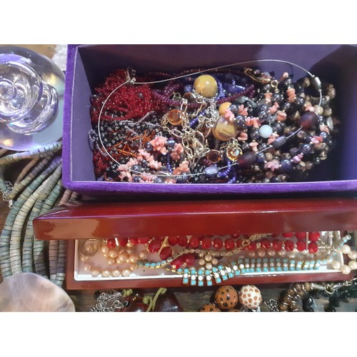 115A - A quantity of fashion jewellery, mainly modern bead necklaces together with a glass paperweight, all... 