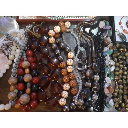 115A - A quantity of fashion jewellery, mainly modern bead necklaces together with a glass paperweight, all... 