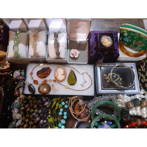 115A - A quantity of fashion jewellery, mainly modern bead necklaces together with a glass paperweight, all... 