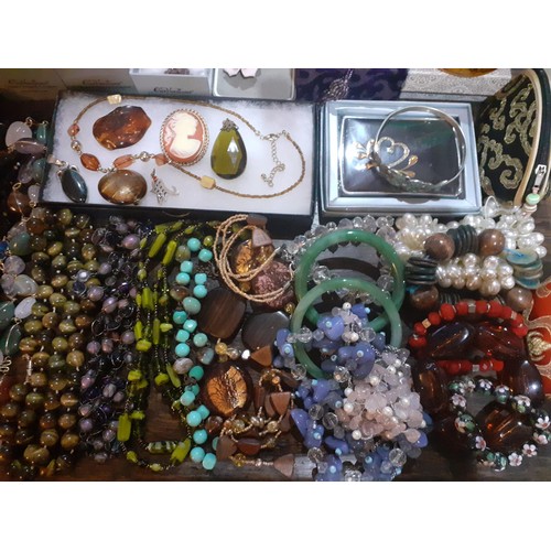 115A - A quantity of fashion jewellery, mainly modern bead necklaces together with a glass paperweight, all... 