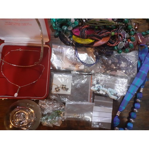 115A - A quantity of fashion jewellery, mainly modern bead necklaces together with a glass paperweight, all... 