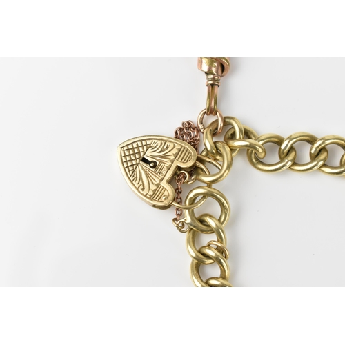 123 - A 9ct yellow gold curb link bracelet, with heart shaped padlock clasp and safety chain, and plated s... 