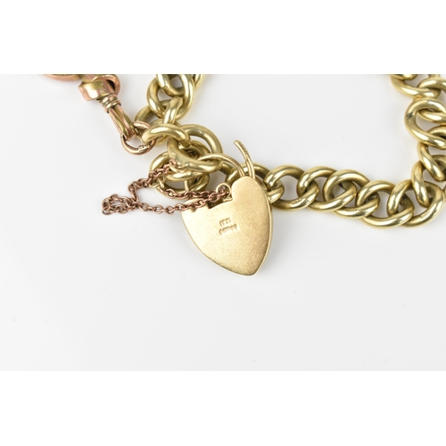 123 - A 9ct yellow gold curb link bracelet, with heart shaped padlock clasp and safety chain, and plated s... 