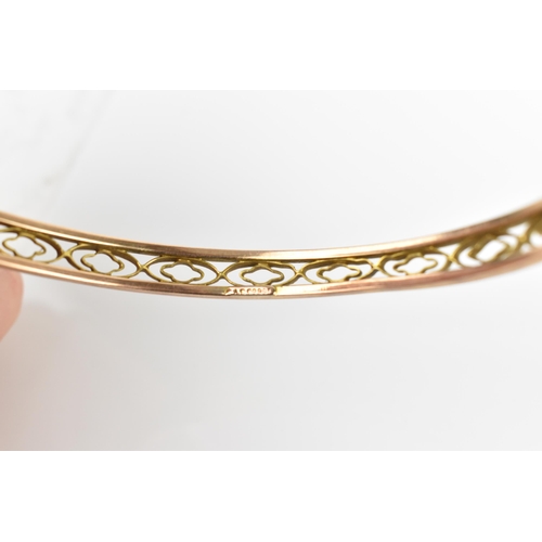 125 - A 9ct rose gold bangle, with pierced frieze design, 8cm diameter, weight 11.5 grams Location:CAB1