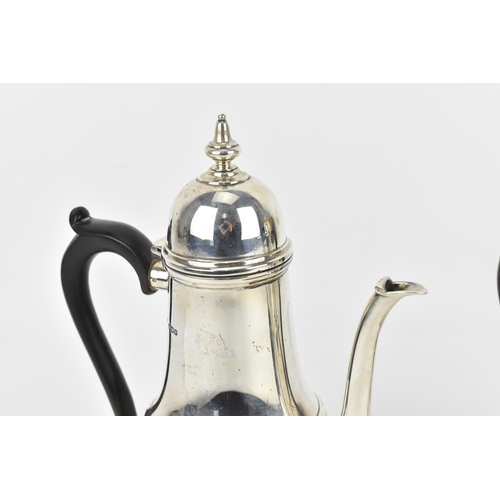 134 - A pair of George V silver hot water and coffee pot by Mappin & Webb, each of baluster form with dome... 