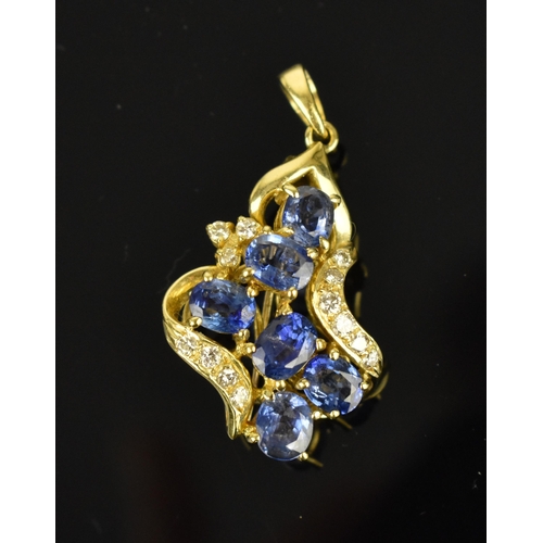 150 - An 18ct yellow gold, diamond and sapphire pendant/brooch, inset with six cornflower blue sapphires f... 