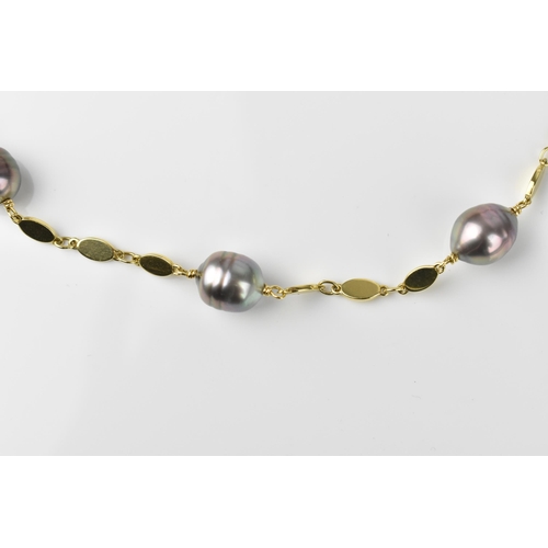 151 - A yellow metal and baroque cultured Tahitian pearl necklace, with three flat links between each pear... 