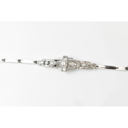 152 - An Art Deco 18ct white gold and diamond bracelet, with stretch bracelet, inset with thirteen central... 