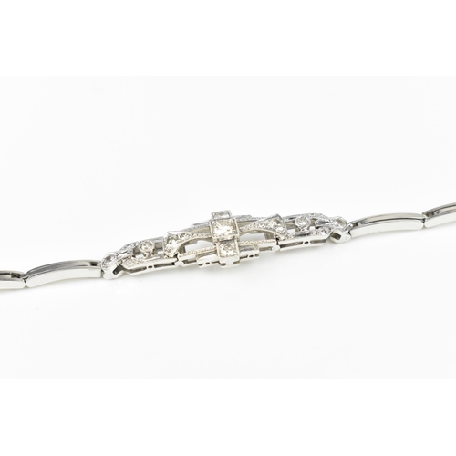 152 - An Art Deco 18ct white gold and diamond bracelet, with stretch bracelet, inset with thirteen central... 