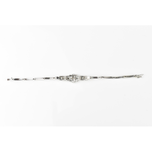 152 - An Art Deco 18ct white gold and diamond bracelet, with stretch bracelet, inset with thirteen central... 