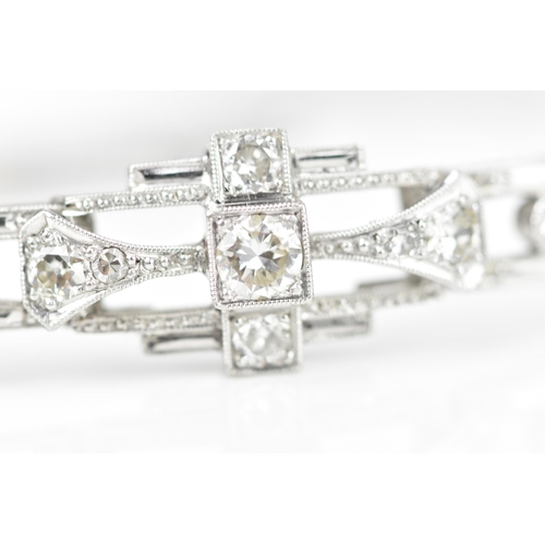 152 - An Art Deco 18ct white gold and diamond bracelet, with stretch bracelet, inset with thirteen central... 