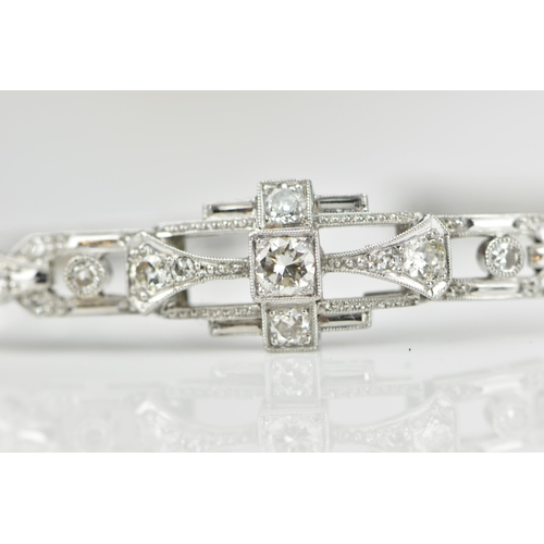 152 - An Art Deco 18ct white gold and diamond bracelet, with stretch bracelet, inset with thirteen central... 