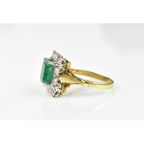 153 - An 18ct yellow gold, emerald and diamond dress ring, with central step cut emerald in a halo of twel... 