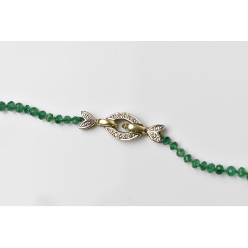 155 - A single strand graduated emerald bead necklace, with 9ct yellow gold and diamond clasp, stamped 375... 