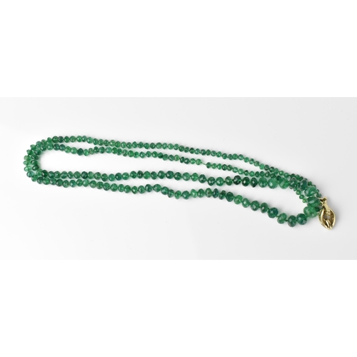 155 - A single strand graduated emerald bead necklace, with 9ct yellow gold and diamond clasp, stamped 375... 