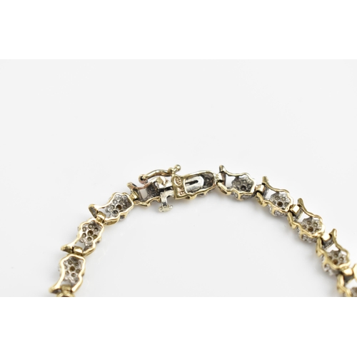 167 - A 9ct yellow gold and diamond bracelet, designed with twenty-seven floral diamond clusters, with cat... 