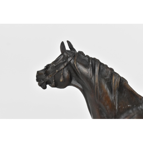 180 - A patinated bronze model of an Arab stallion, with tasselled bridle, signed and dated to the base 'D... 