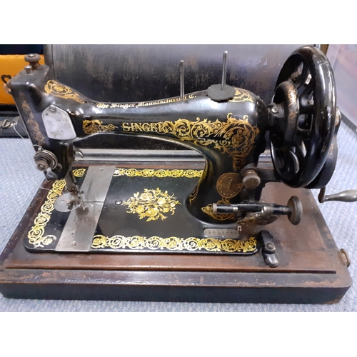 143 - An 1870's Singer sewing machine in oak case, serial number 12059692
Location:1.5