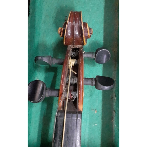 150 - An early 20th century violin, no label, with two bows in a fitted case together with another later v... 