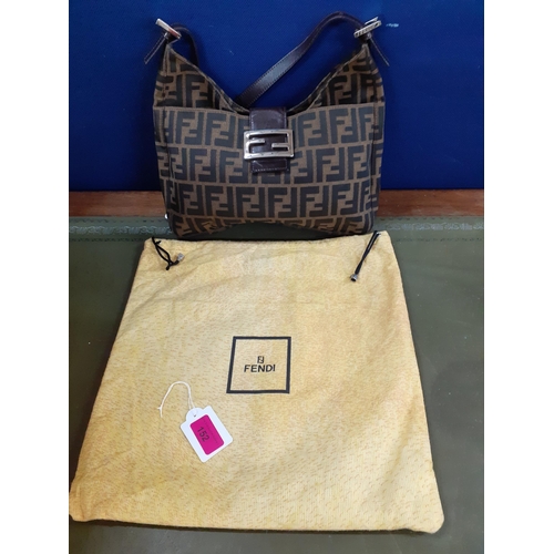 152 - A Fendi 'Baguette' brown shoulder bag in double FF monogram Zucca canvas with silver tone hardware, ... 