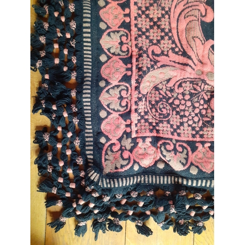 157 - A 1970's Casa Pupo rug in salmon pink and green colourway on a black ground having a black hand-tied... 