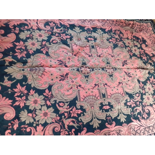 157 - A 1970's Casa Pupo rug in salmon pink and green colourway on a black ground having a black hand-tied... 