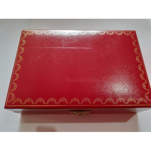 159 - A small red Cartier jewellery box:BWR