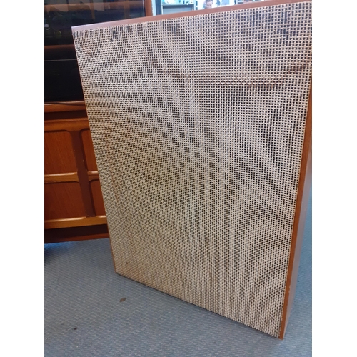 160 - A vintage music system in a teak housing unit with smoky glazed door above a record rack, comprising... 