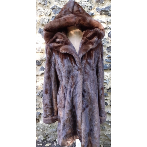 161 - A late 20th Century/early 21st Century brown mink swing coat with hood and shawl collar, 38/40