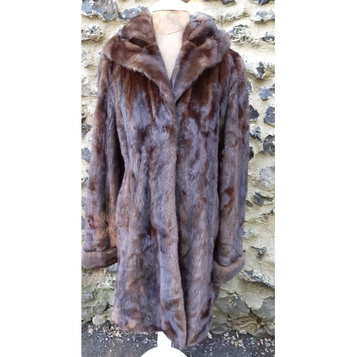 161 - A late 20th Century/early 21st Century brown mink swing coat with hood and shawl collar, 38/40