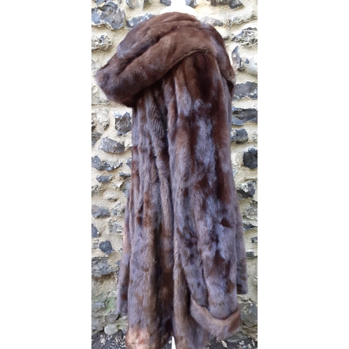 161 - A late 20th Century/early 21st Century brown mink swing coat with hood and shawl collar, 38/40