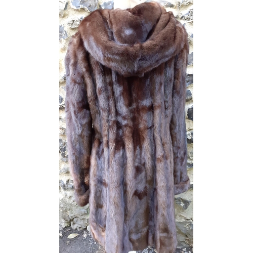 161 - A late 20th Century/early 21st Century brown mink swing coat with hood and shawl collar, 38/40