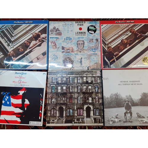 168 - A small collection of 1960's and later records to include The Beatles, Led Zeppelin, Focus, Gallaghe... 