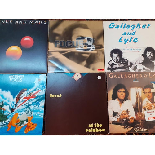 168 - A small collection of 1960's and later records to include The Beatles, Led Zeppelin, Focus, Gallaghe... 