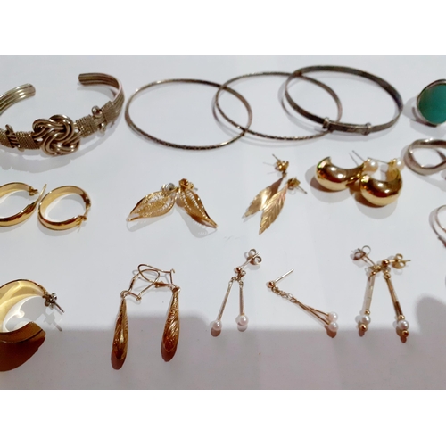 186 - Four white metal bangles, gold tone and gold earrings, a pair of silver cufflinks, 4 silver rings an... 