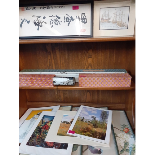 192 - A small selection of prints and scrolls to include Claude Monet scenes and Oriental inspired prints.... 