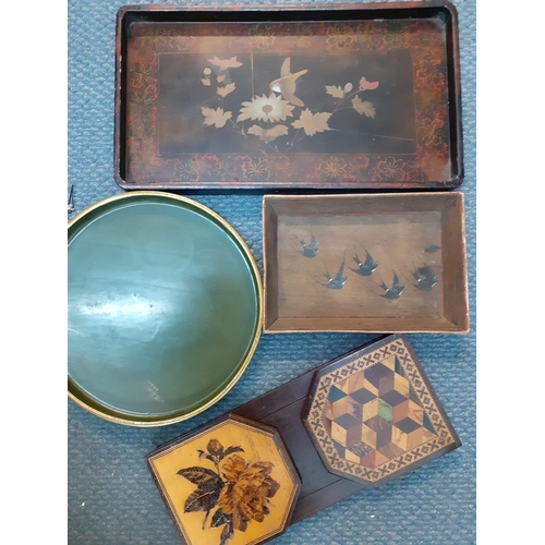 259 - A small treen lot comprising Oriental trays, one hand painted with images of Swallows and a parquetr... 