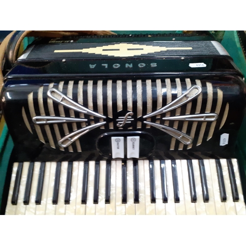 162 - A Sonola 1101 accordion with pearlescent buttons, a clarinet and master key in a green felt lined ca... 