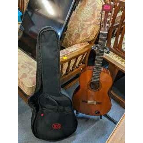 189 - A Yamaha acoustic guitar together with case and stand
Location: A4B