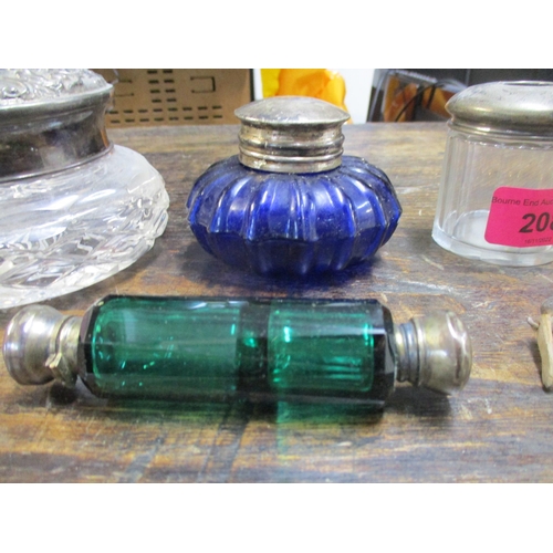 208 - A lot to include a Victorian green glass double ended scent bottle with white metal caps, a Grodnert... 