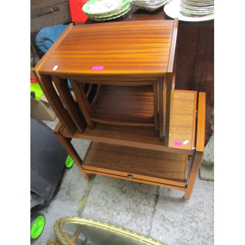 213 - A retro teak trolley, together with a retro teak nest of three tables Location: G