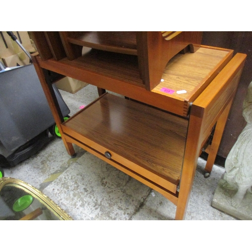 213 - A retro teak trolley, together with a retro teak nest of three tables Location: G