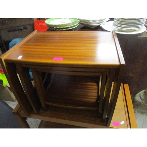 213 - A retro teak trolley, together with a retro teak nest of three tables Location: G