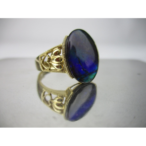 218 - A D'Yack 14k yellow gold and oval opal doublet ring, with beaded and pierced heart decoration to the... 