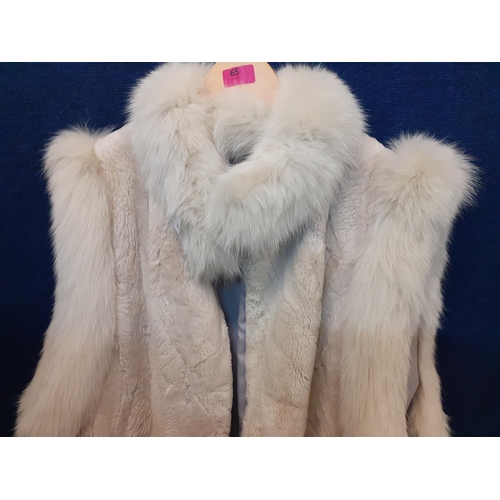 65 - A late 20th Century white faux fur sleeveless coat with arctic fox fur collar and shoulder trim A/F,... 