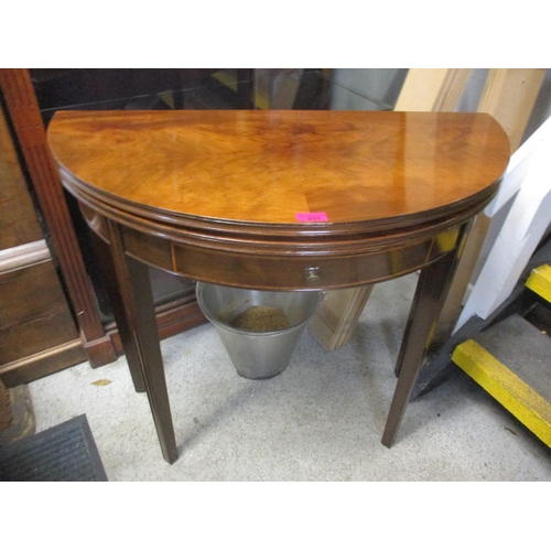 231 - A Waring & Gillows mahogany demi-lune foldover games table with inset drawer Location: BWR